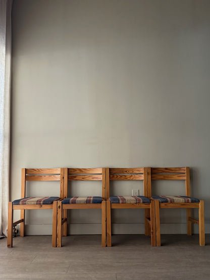 Danish pine plaid upholstered dining chairs. Sold in pairs.