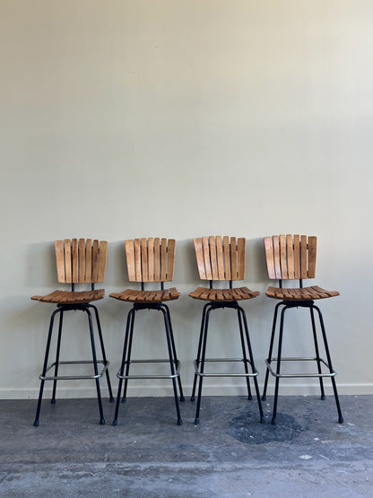 Slatted maple swivel bar stools. Sold in pairs.
