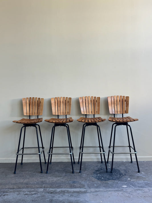 Slatted maple swivel bar stools. Sold in pairs.