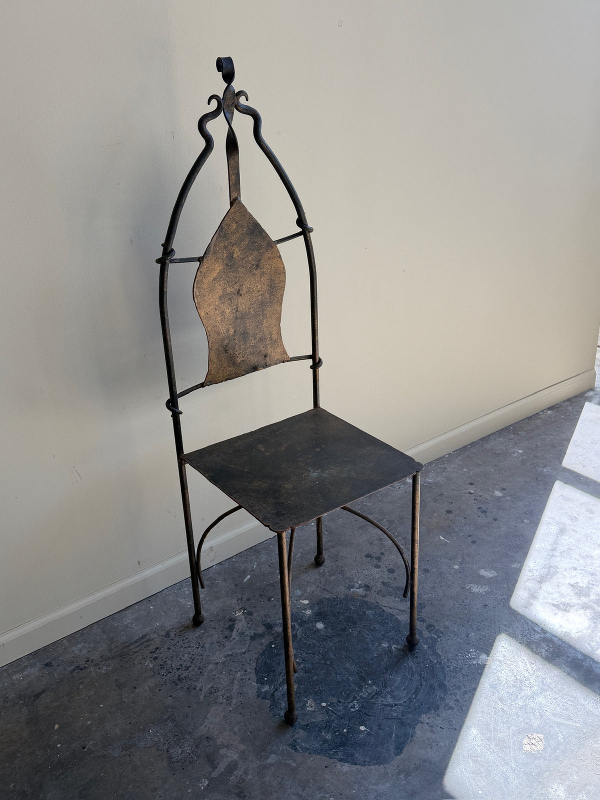 Wrought iron sculptural chairs (right)