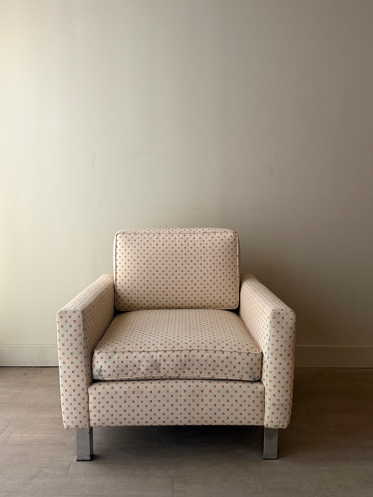Upholstered chrome armchair