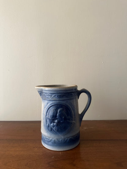 Salt glazed stoneware pitcher with birds