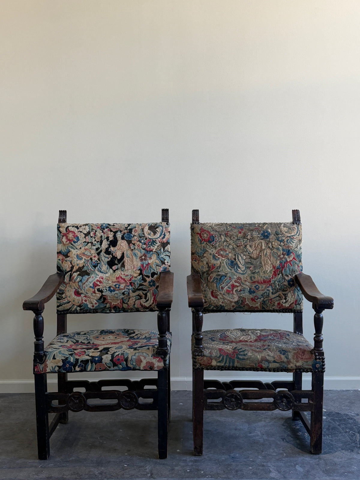 Italian Baroque upholstered walnut armchairs (left)
