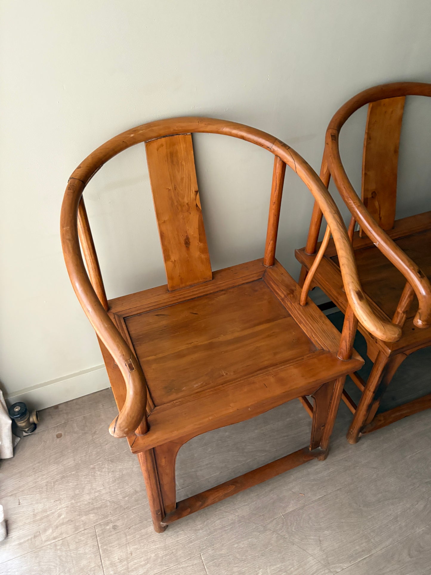 Chinese elmwood yoke back armchairs. Sold individually