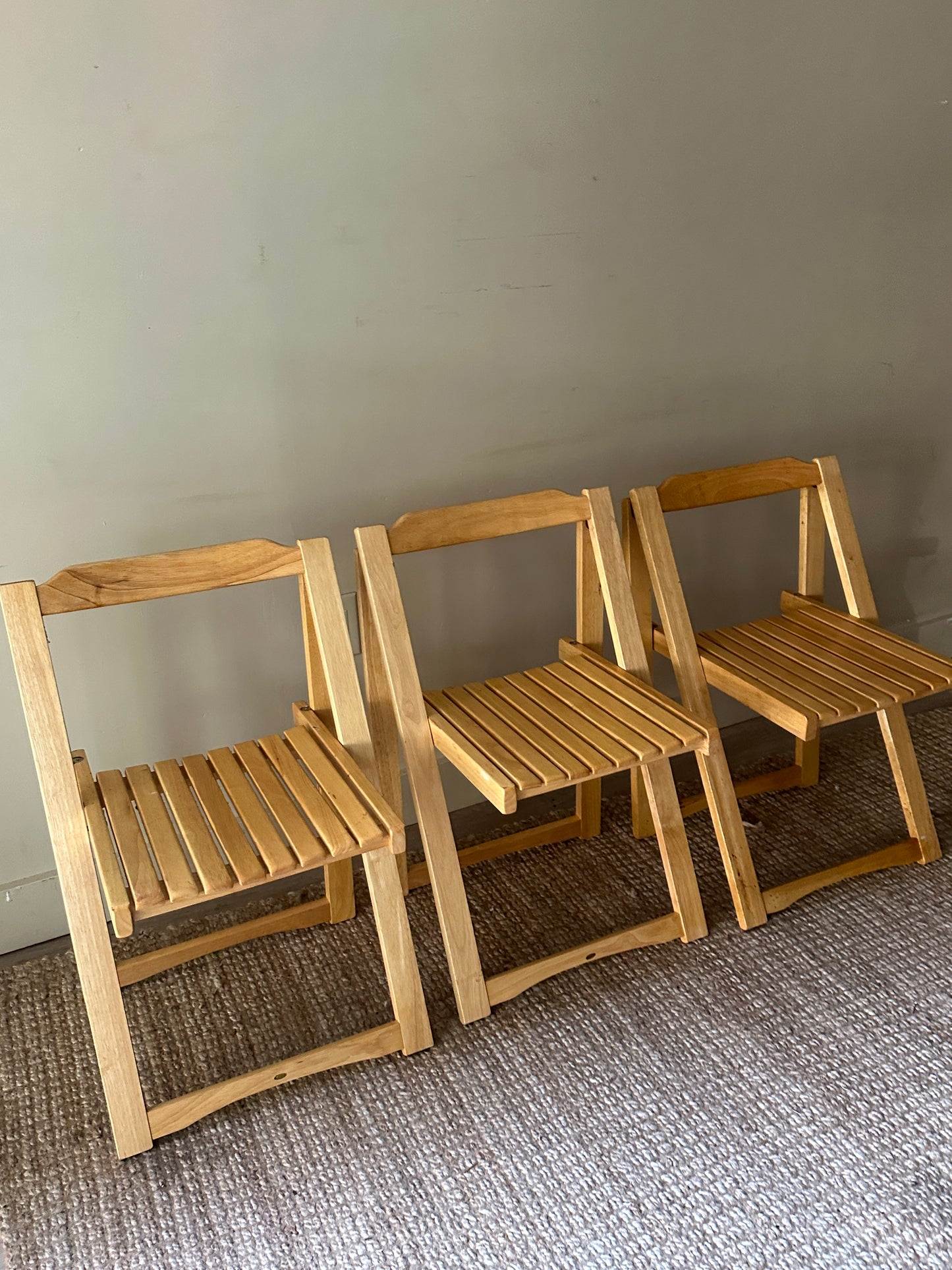 Oak folding chairs. Sold individually.