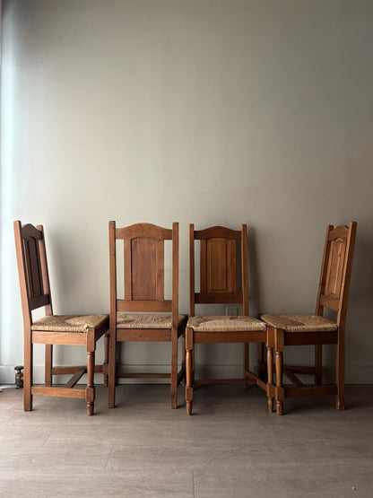Dutch oak rush seat dining chairs. Sold in pairs.