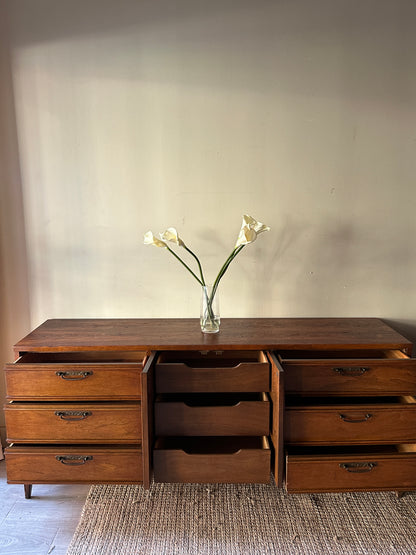 Walnut credenza with carved center handles