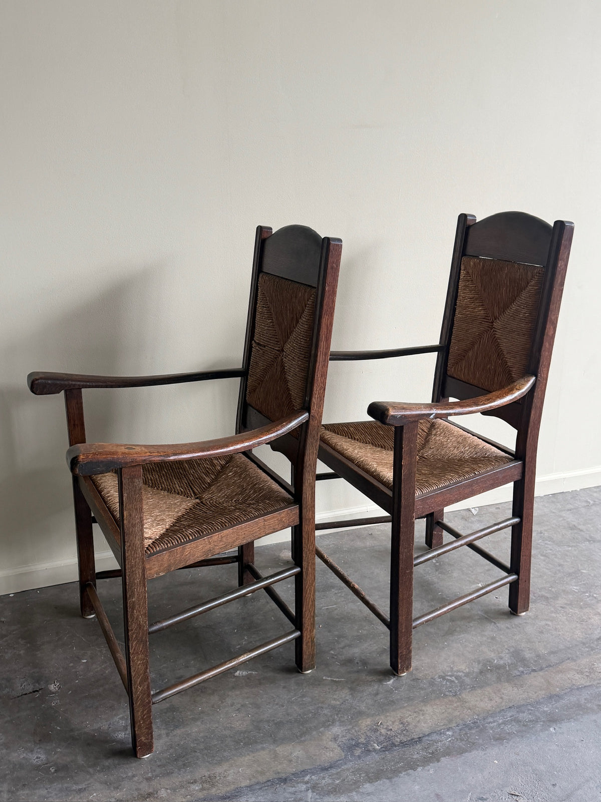 English provincial oak & rush armchairs. Sold individually.