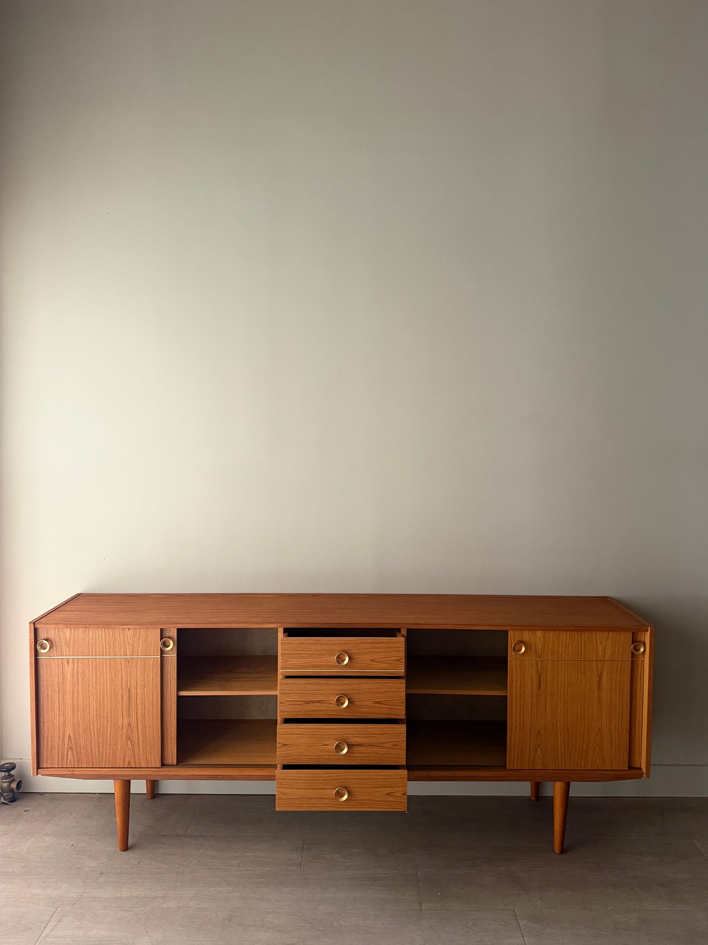 Danish teak sideboard with brass hardware