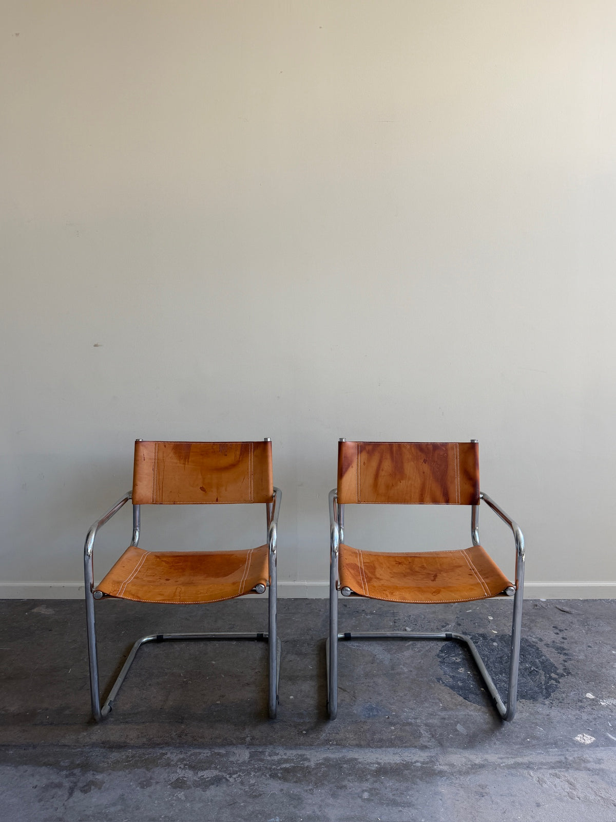 Chrome & leather armchairs. Sold individually.