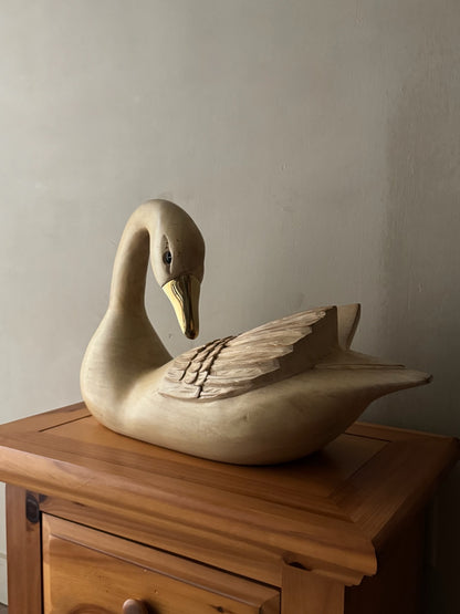 Carved swan sculpture
