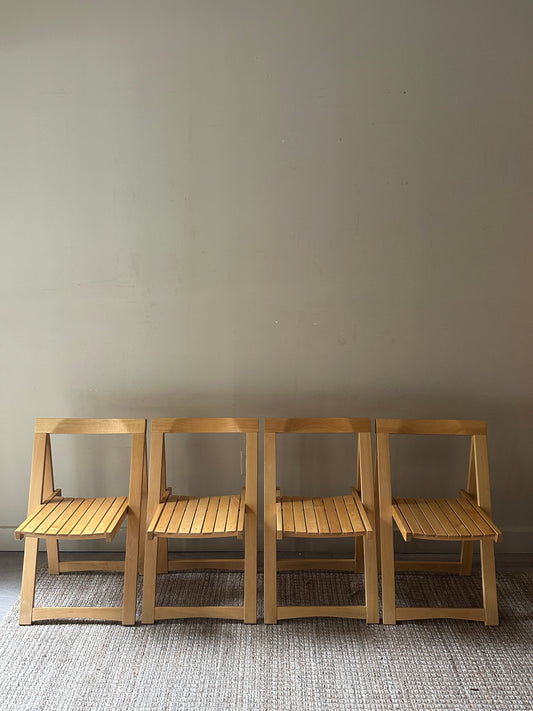 Oak folding chairs. Sold in pairs.