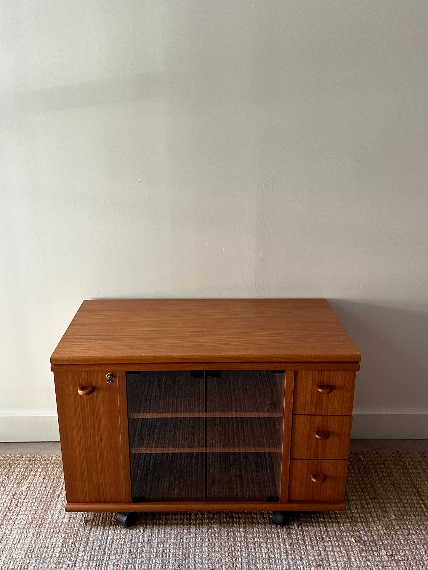 Teak swivel top media cabinet