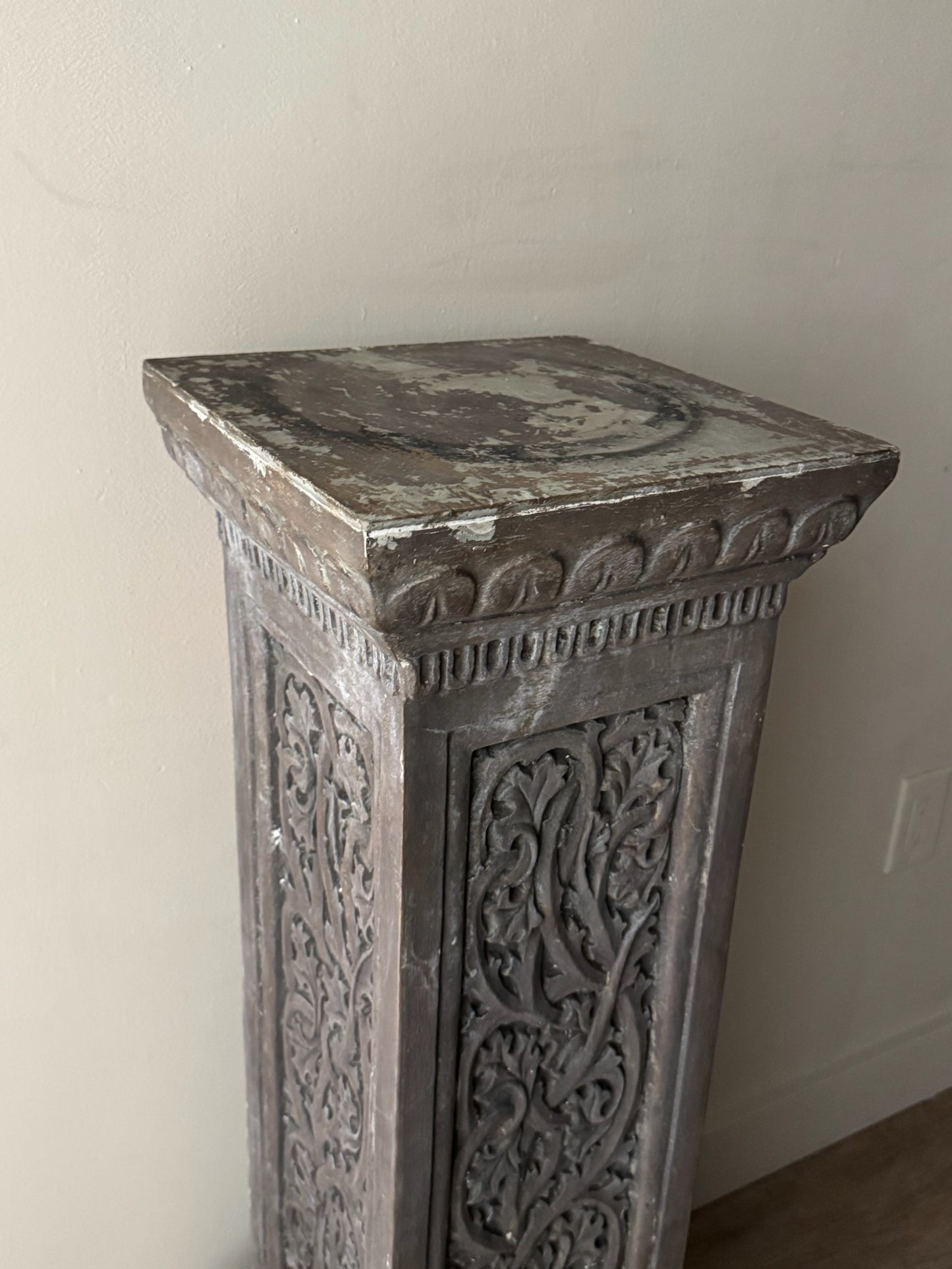 Carved pedestal
