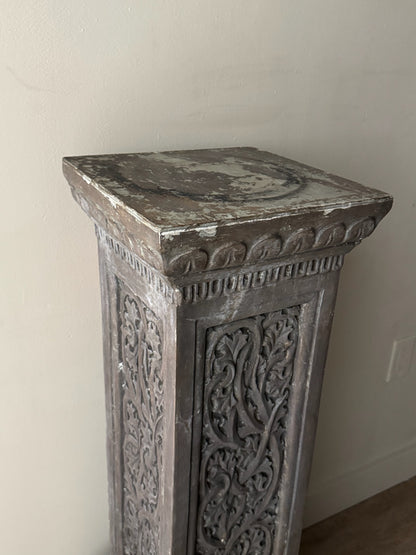 Carved pedestal