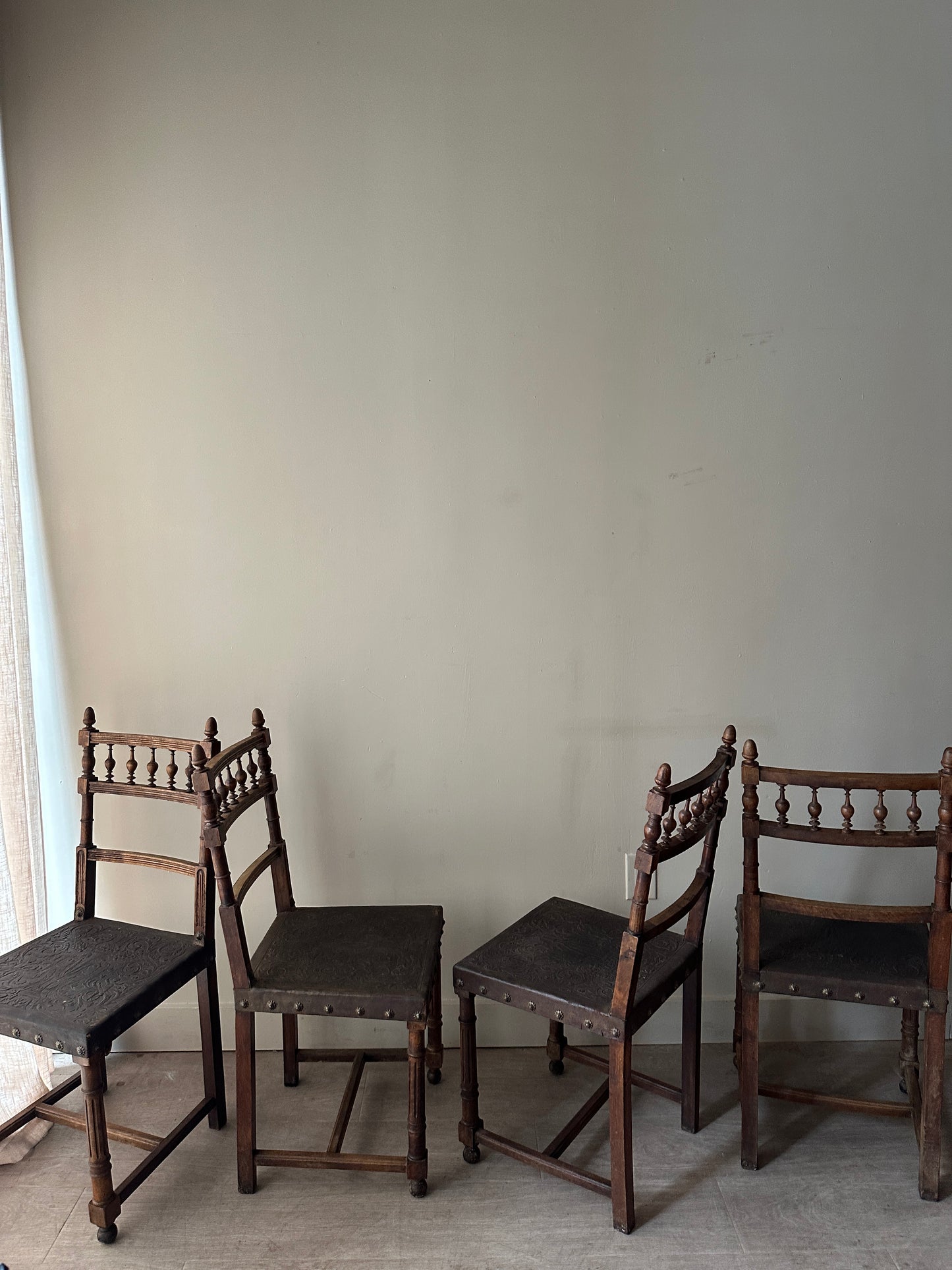 Embossed leather chairs. Sets of 2.