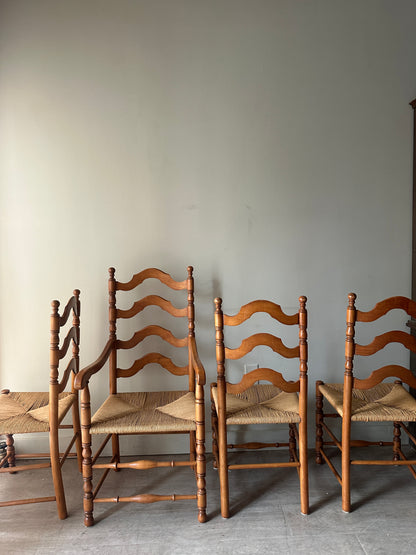 Set of 4 maple and rush dining chairs. 3 armless, 1 arm. Sold as set