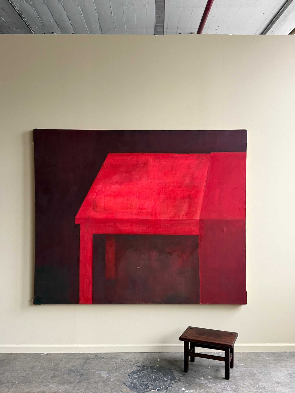 Large red abstract. Signed “Caycedo.”