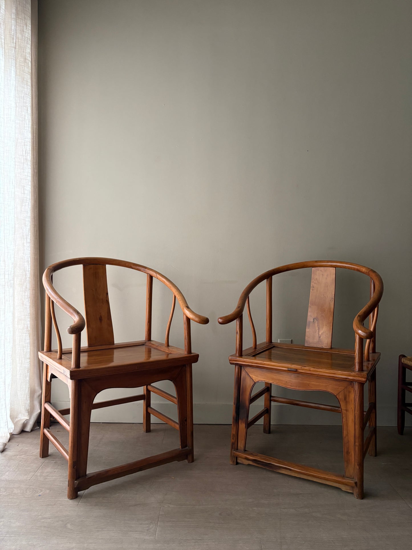 Chinese elmwood yoke back armchairs. Sold individually