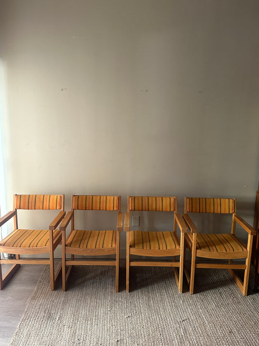 Oak armchairs. Sold individually.