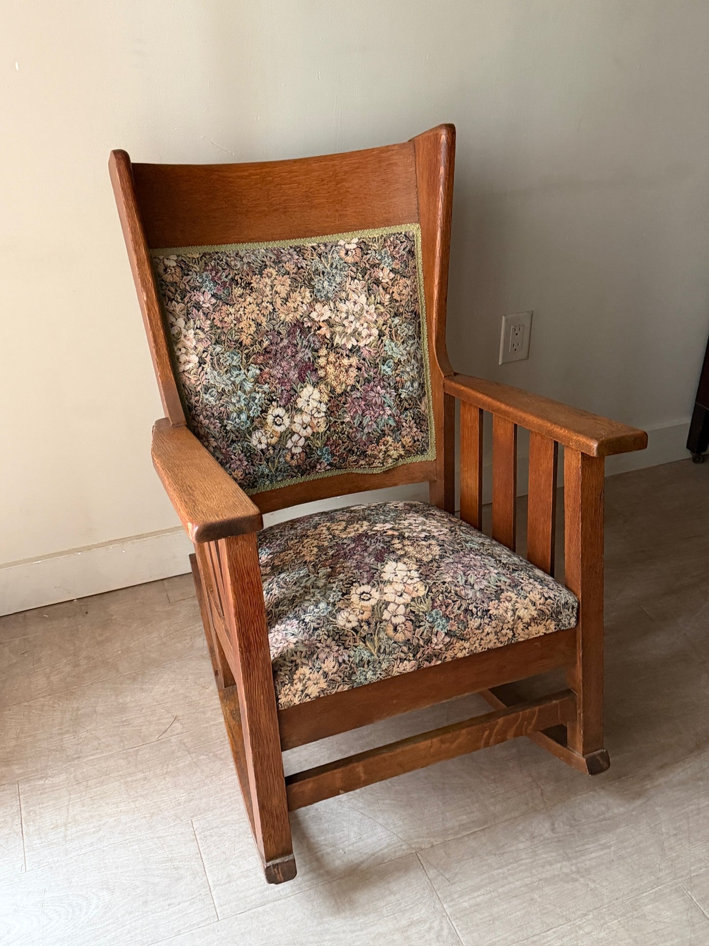 Upholstered golden oak rocking chair