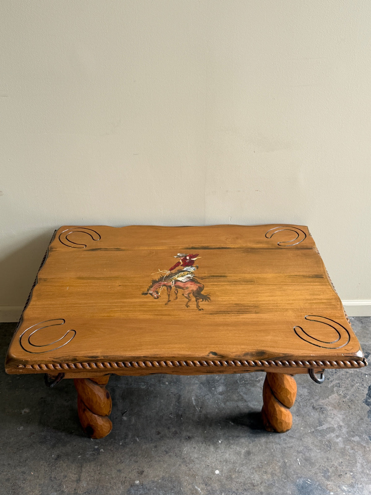 Pine coffee table with equestrian motifs
