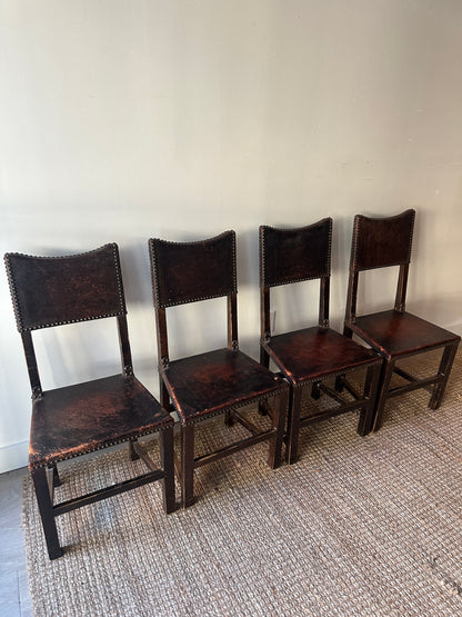 Leather and walnut nailhead dining chairs. Sold individually.