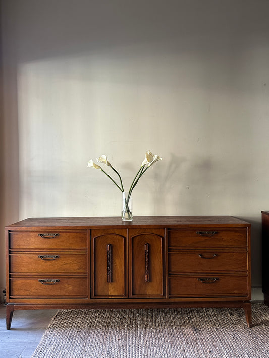 Walnut credenza with carved center handles