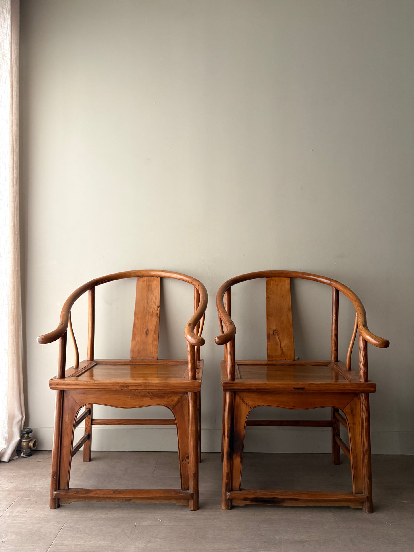 Chinese elmwood yoke back armchairs. Sold individually
