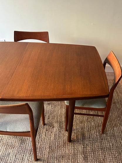 Danish teak dining table with two leaves