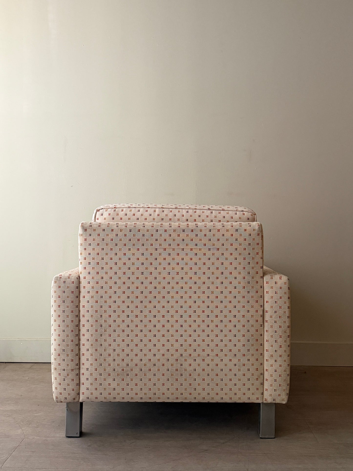 Upholstered chrome armchair
