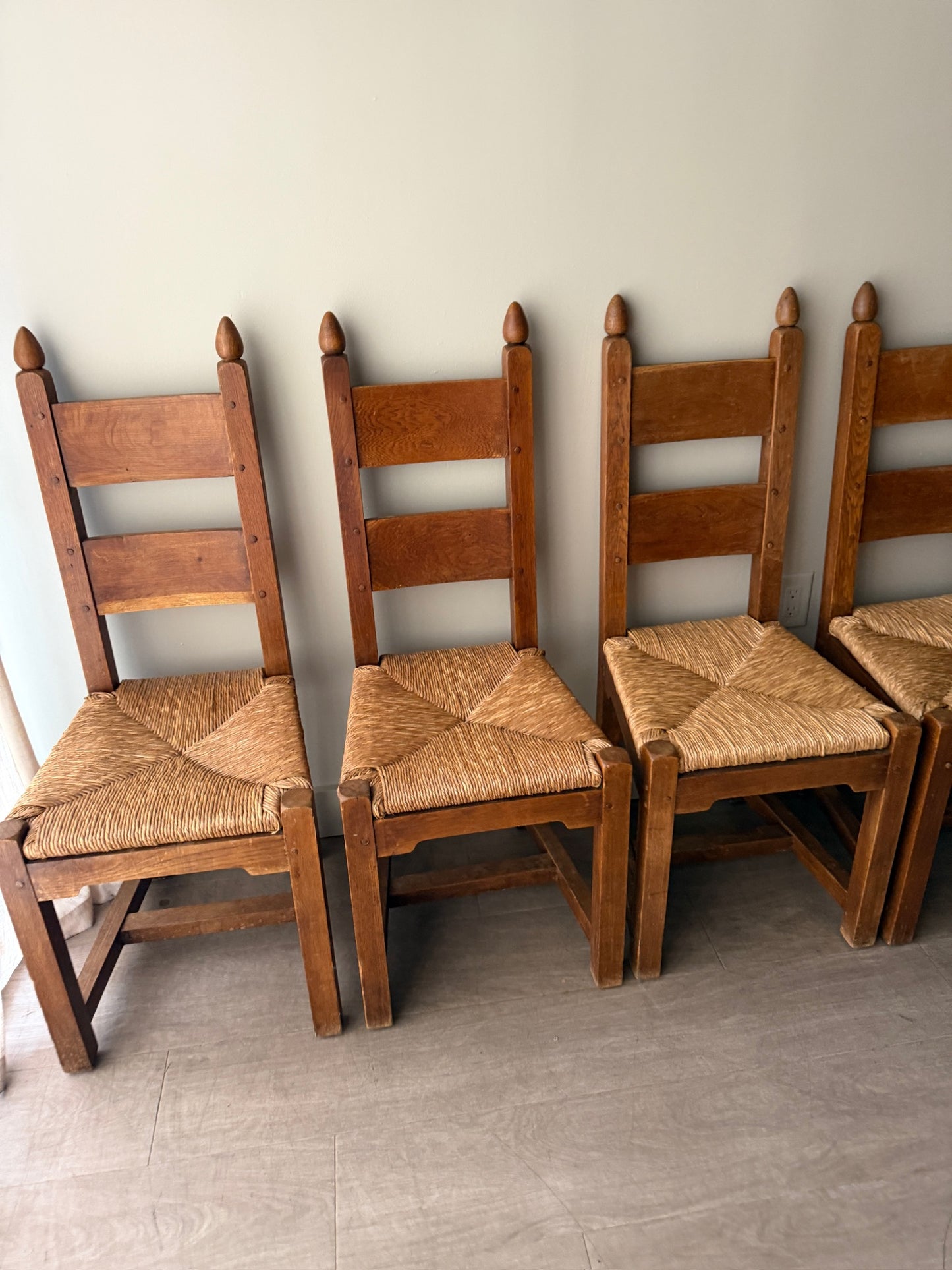 Dutch Brutalist oak rush seat dining chairs. Sold in pairs.