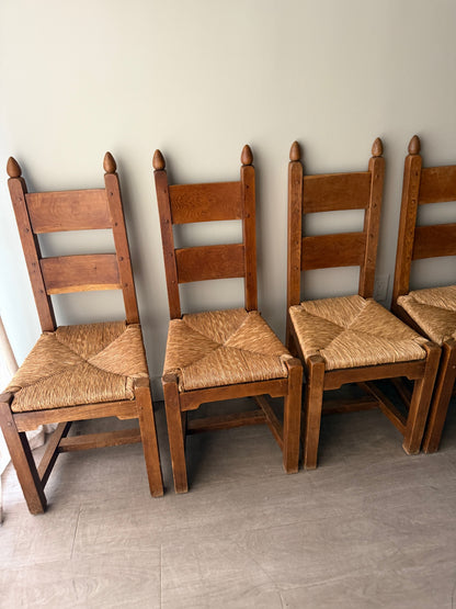 Dutch Brutalist oak rush seat dining chairs. Sold in pairs.