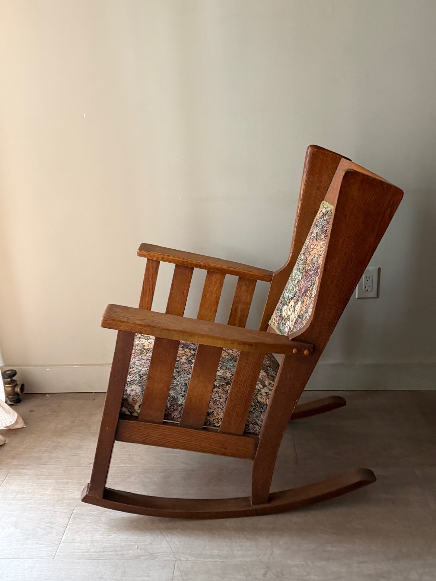 Upholstered golden oak rocking chair