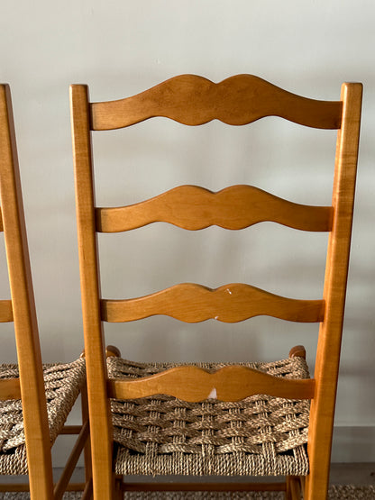 Ladder back chairs with woven seats. Sold in sets of 2.