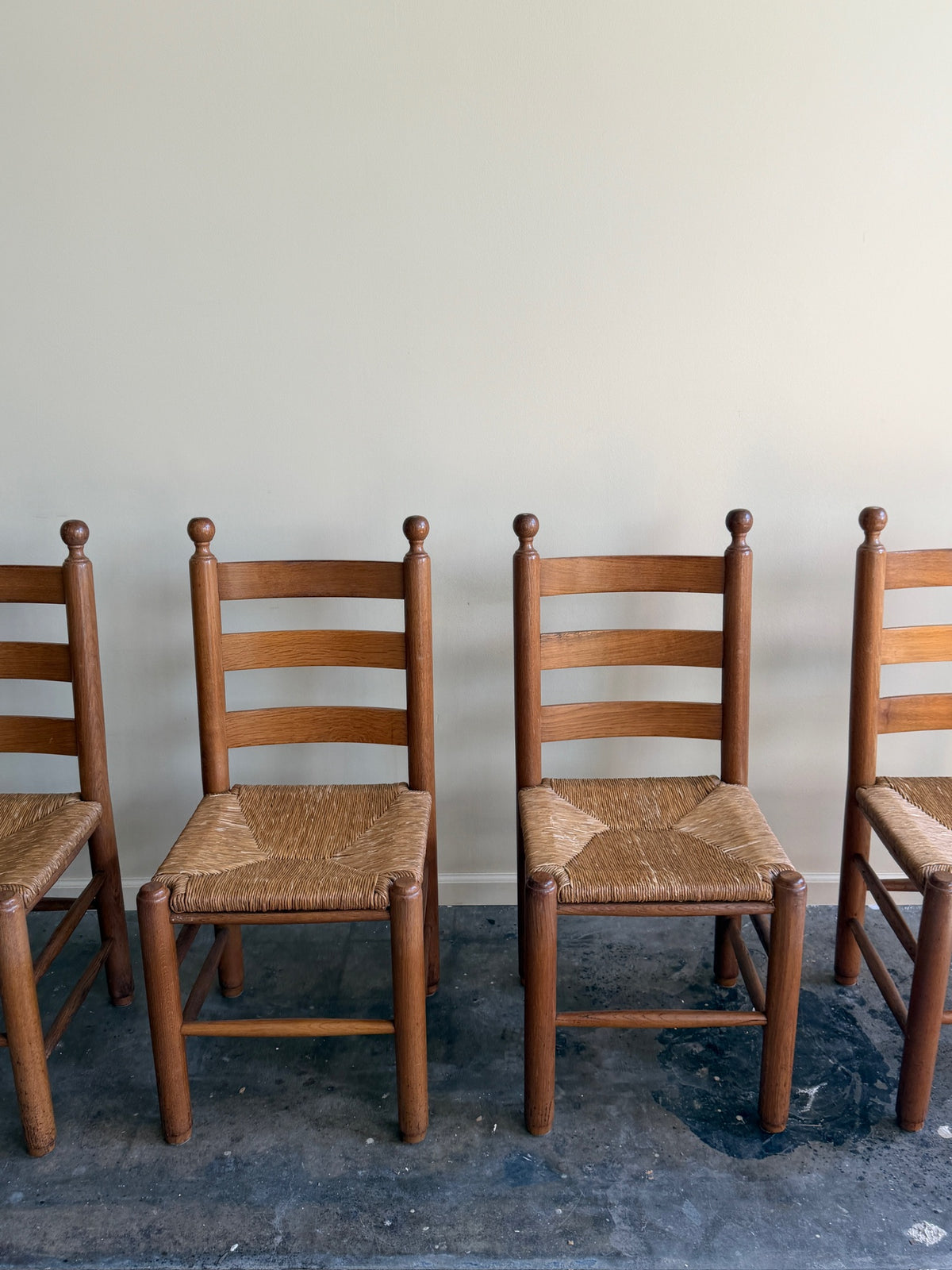 French oak rush seat dining chairs. Sold as a set of 4.