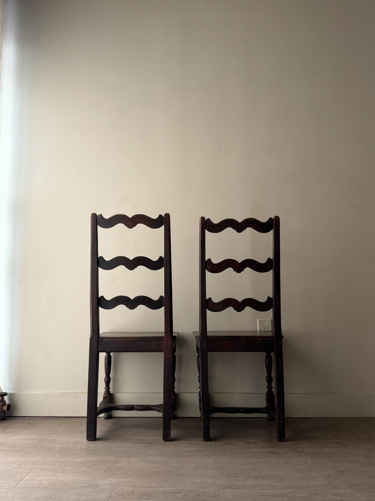 French oak ladder back dining chairs. Sold as a pair.