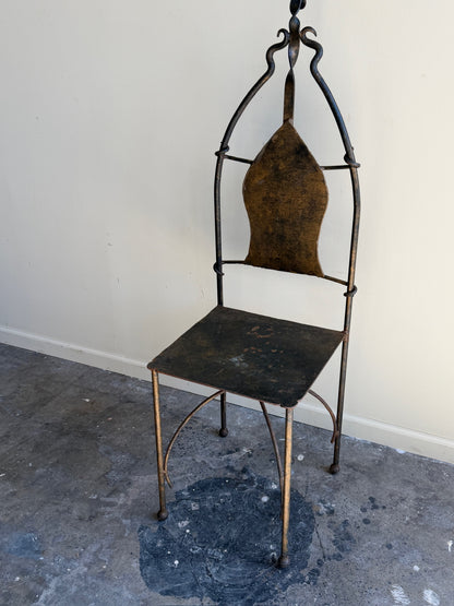 Wrought iron sculptural chairs (right)