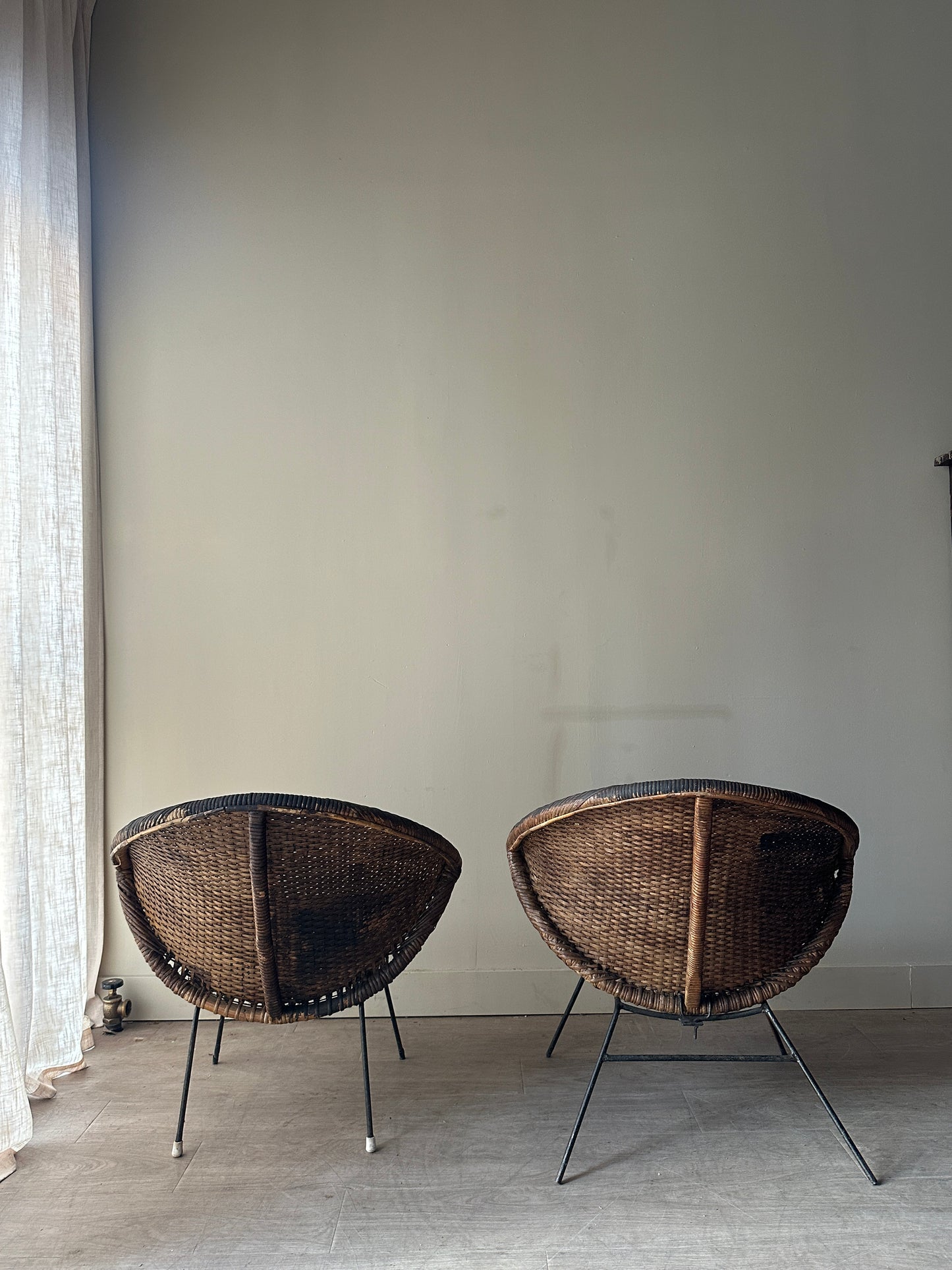Woven rattan hoop chairs. Sold individually.