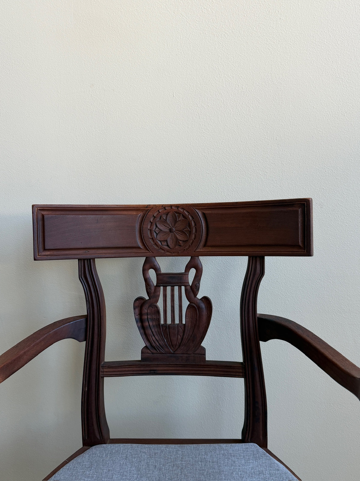 Carved mixed wood armchair