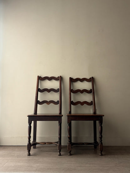 French oak ladder back dining chairs. Sold as a pair.