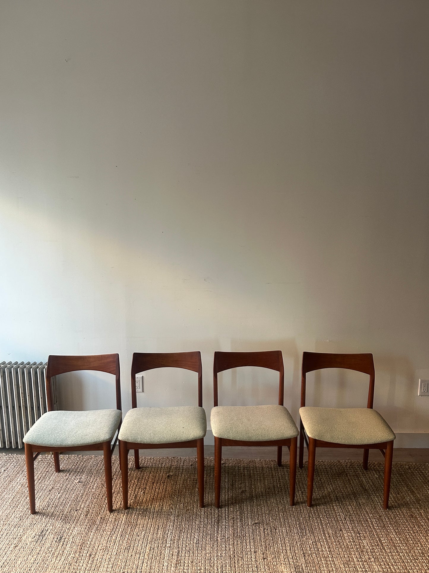 Teak dining chairs. Sold as a set of 4.