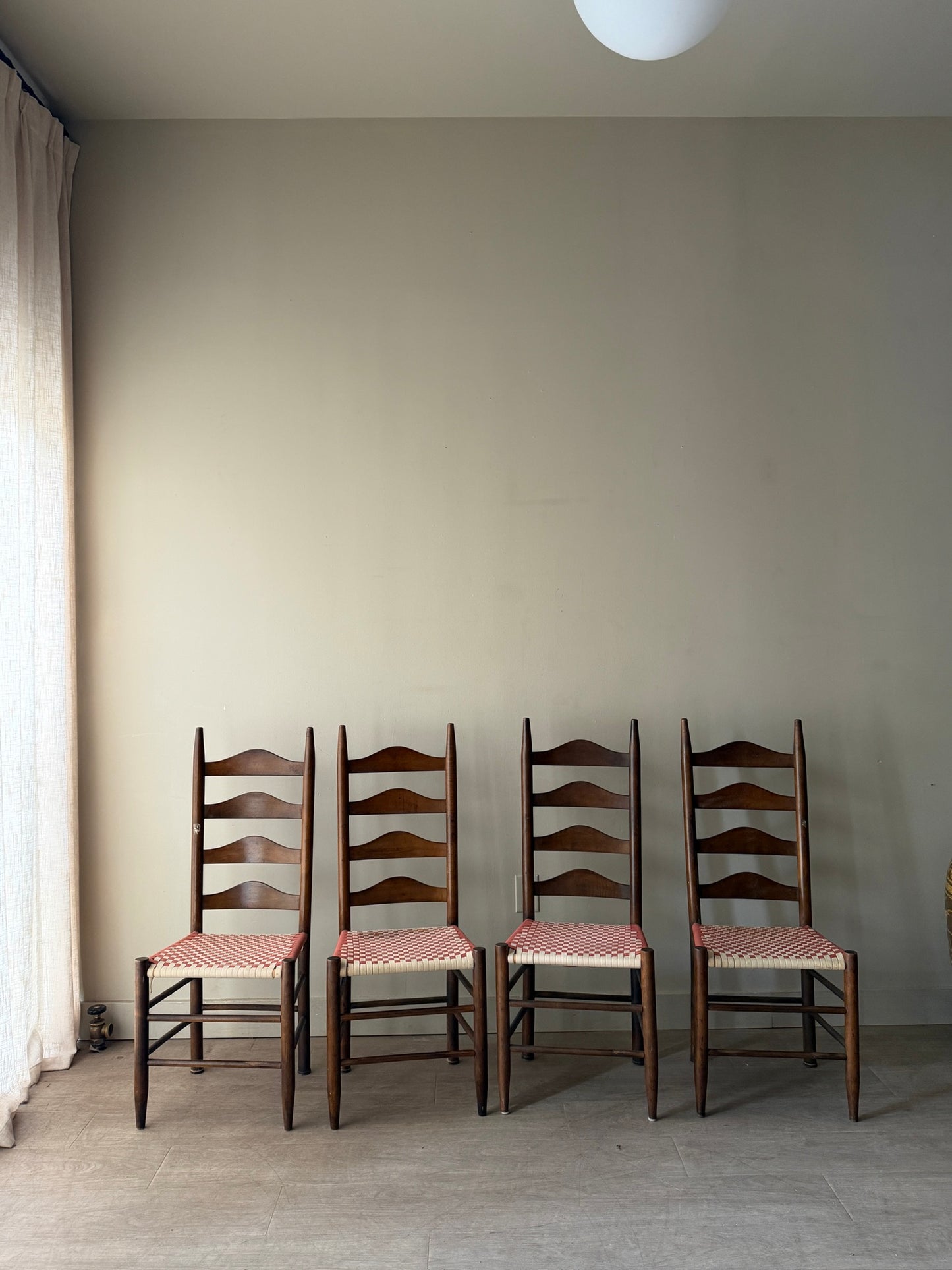 Pine ladder back chairs with woven checked seats. Sold as a set of 4.