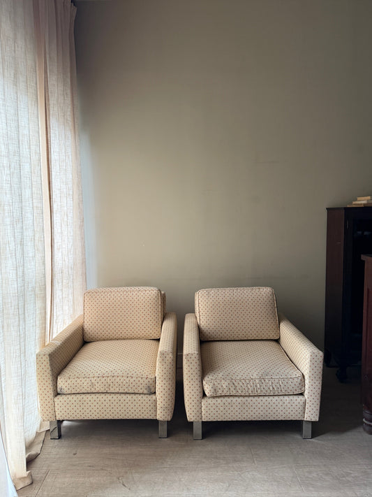 Upholstered chrome armchairs. Left.