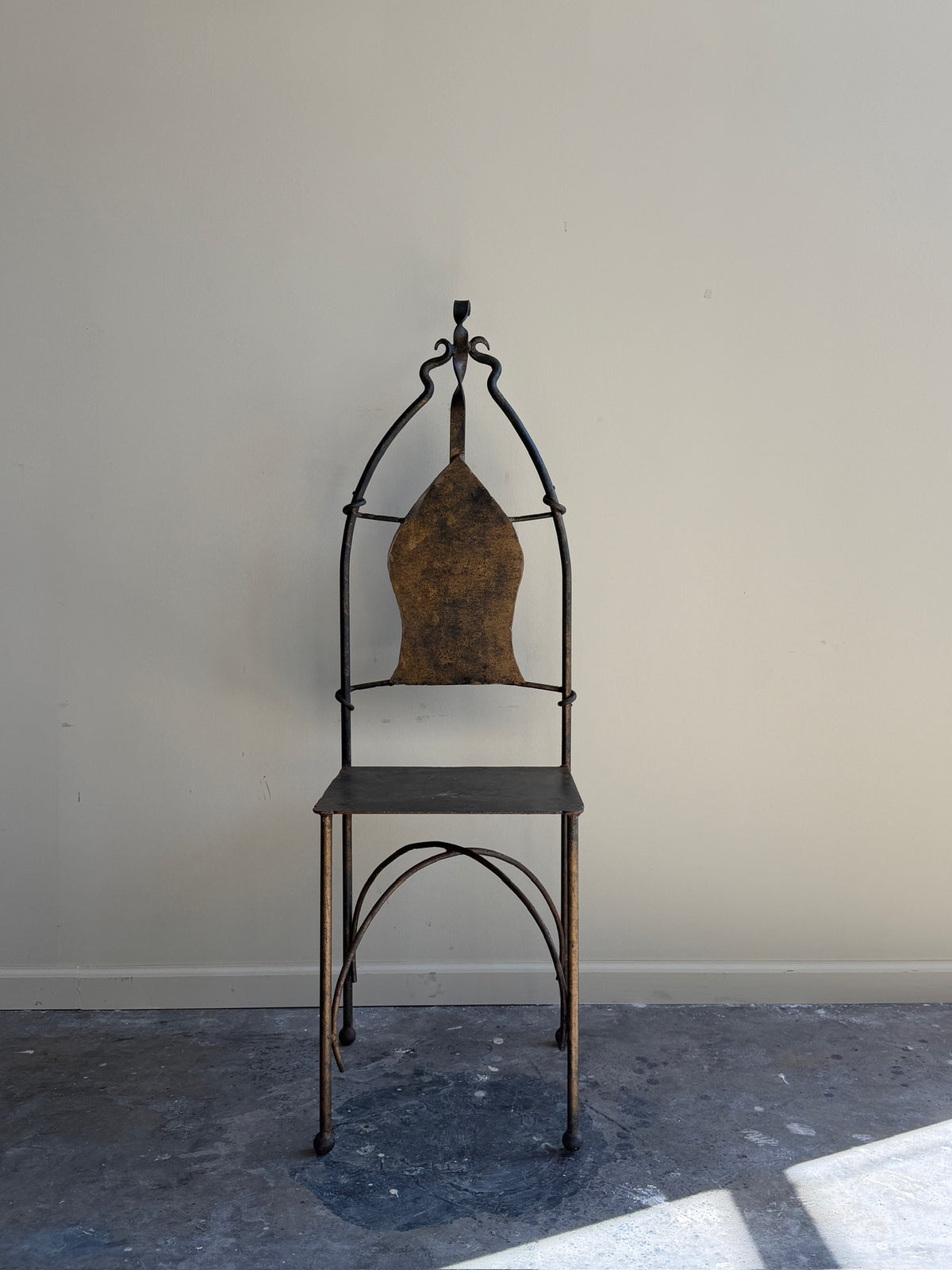 Wrought iron sculptural chairs (right)