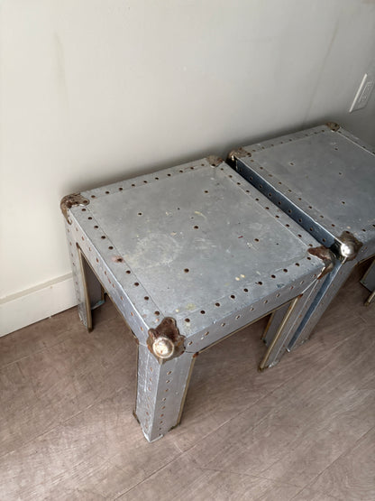 Riveted metal cocktail tables. Sold individually.