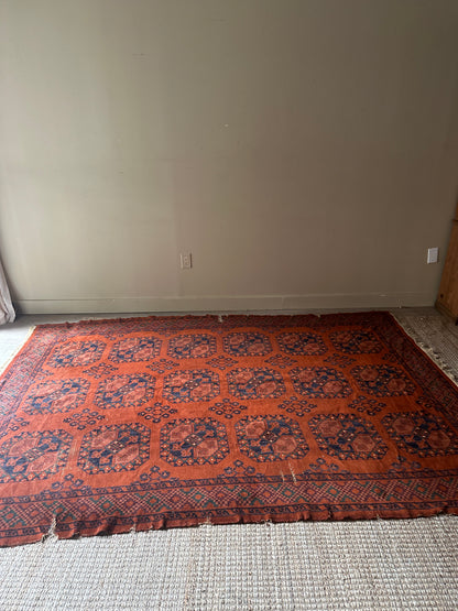 Low pile, rust colored rug