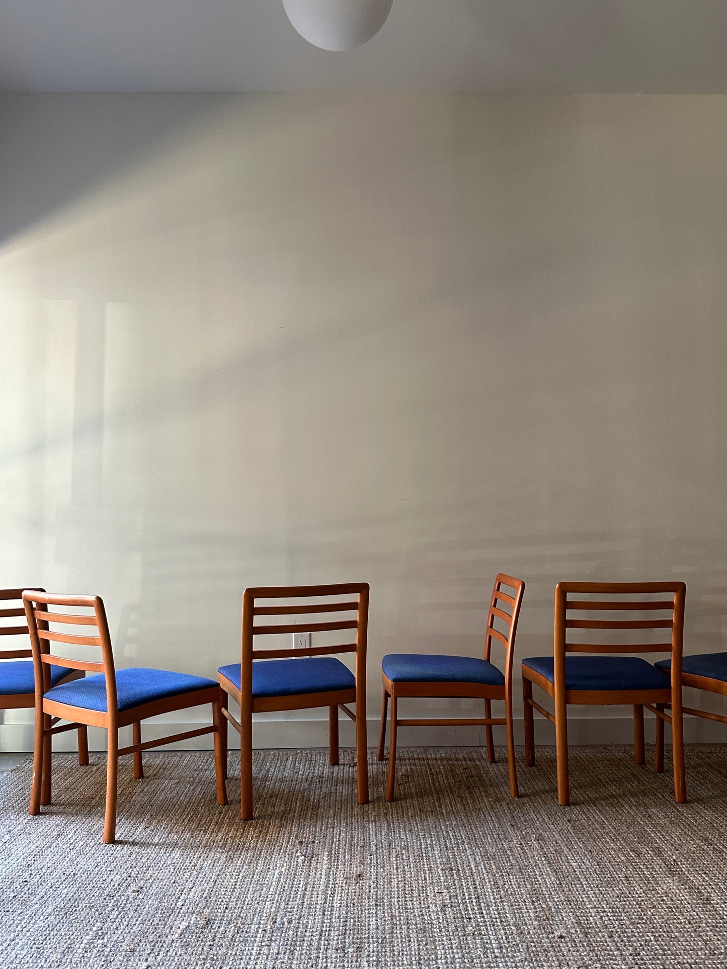 2 maple dining chairs. Sold individually.