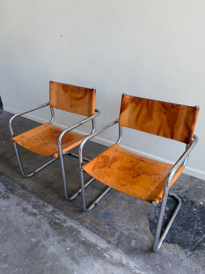 Chrome & leather armchairs. Sold individually.