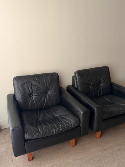 Danish black leather lounge chairs. Sold individually.